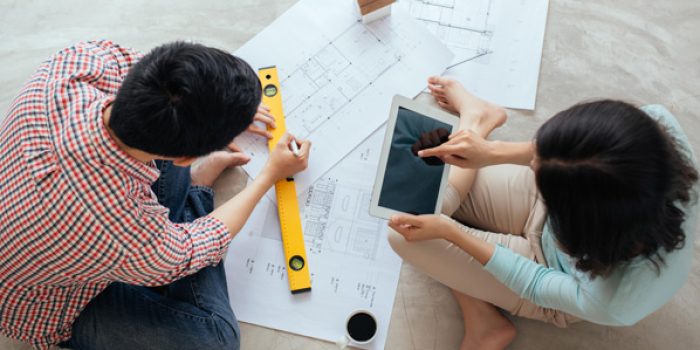 PLANNING-EASY-AUG25-COUPLE-LOOKING-AT-PLANS