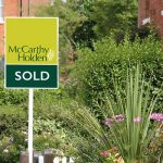 McCarthy Holden estate agents sold board