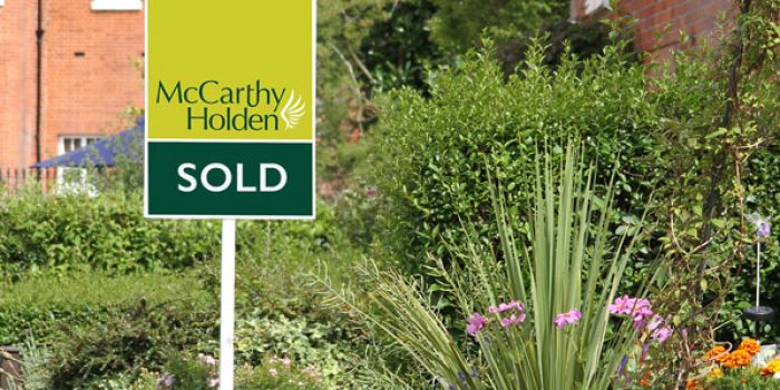 McCarthy Holden estate agents sold board